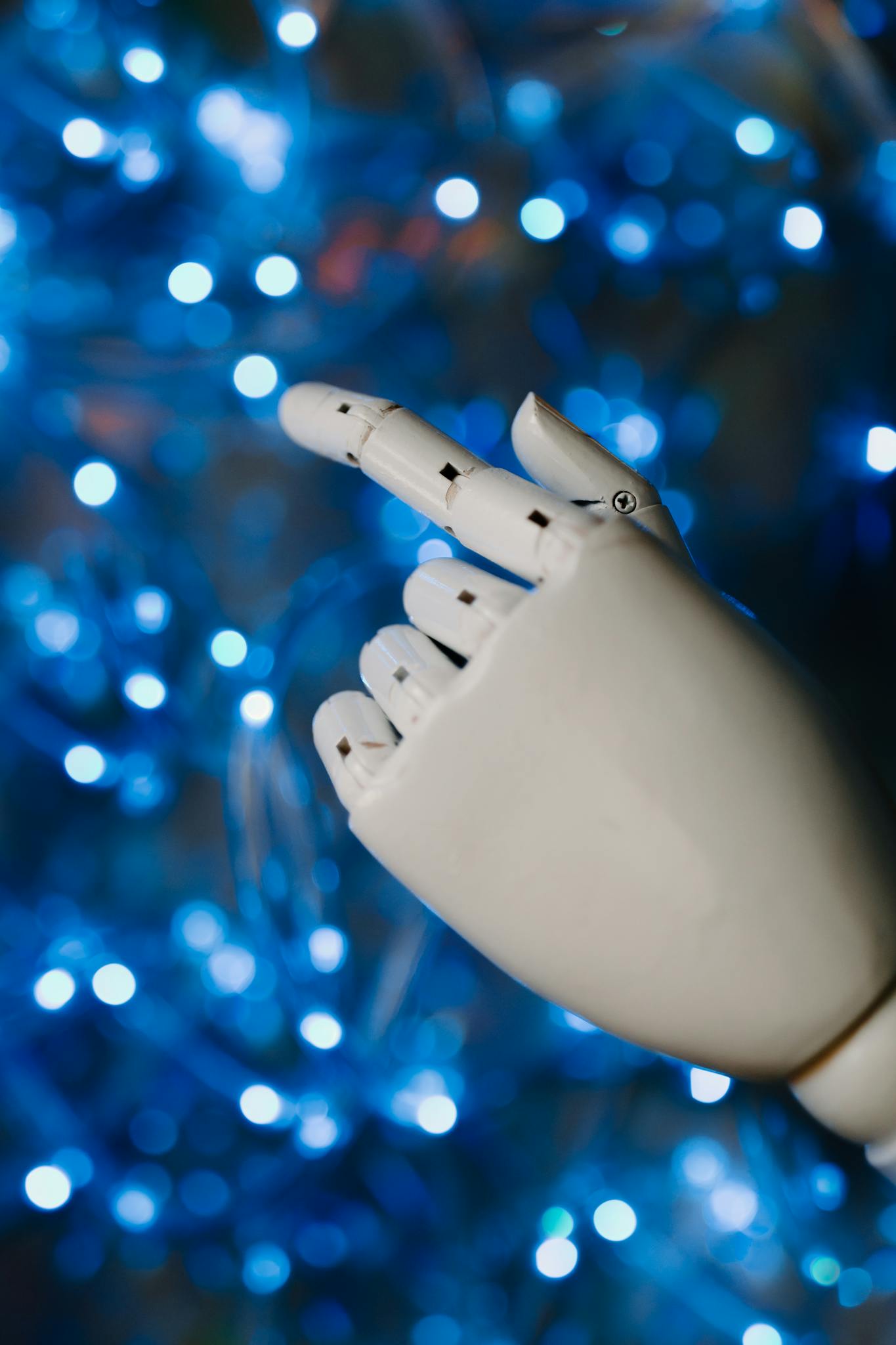 close up of a robotic hand with glowing